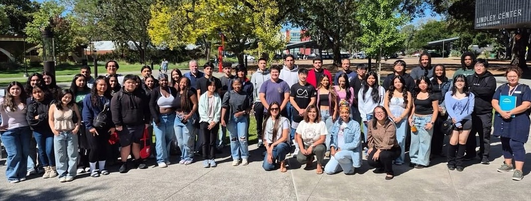 Large group picture of at least 50 students posing in front of Lindley Center.